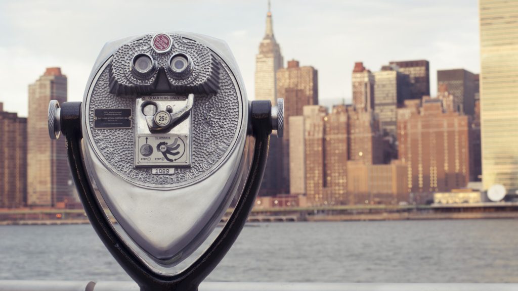 Coin operated binocular and skyline in background